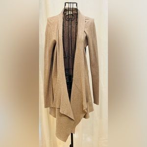 Tan thigh length sweater. Awesome fit. Comfy. Never worn.